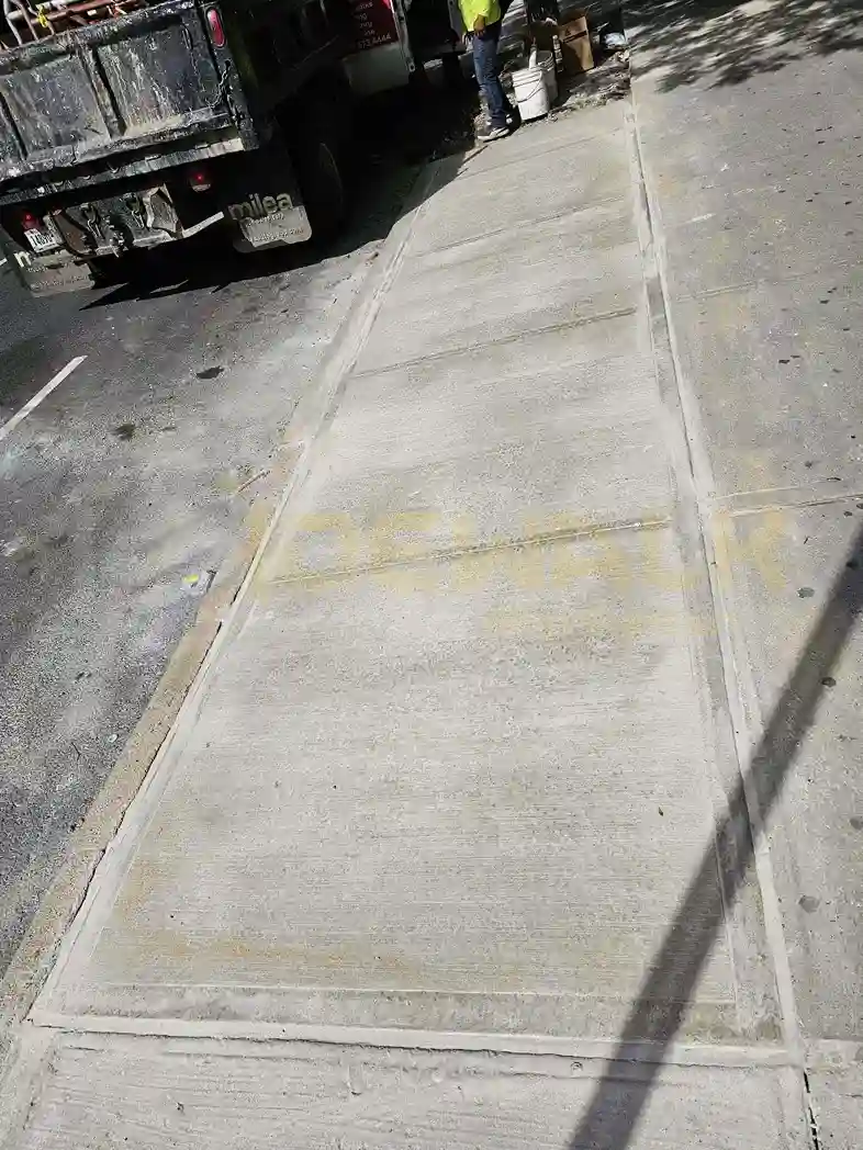 a single slab replaced of broken sidewalk in New York City